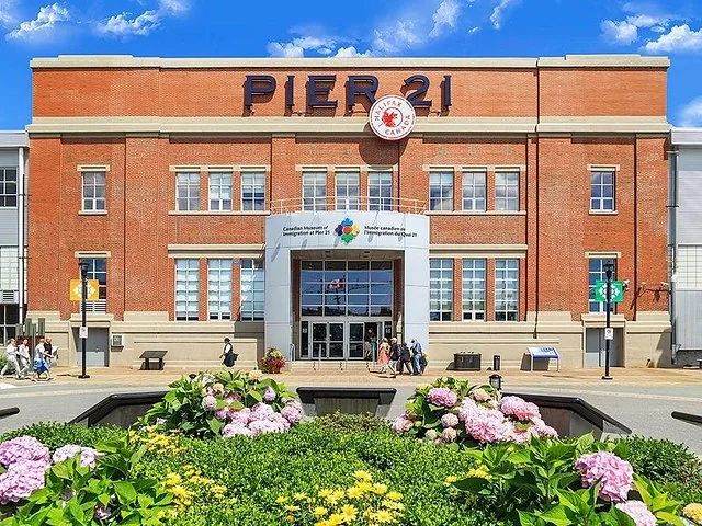 Exterior view of Pier 21 brick building with flowers in front